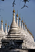 Myanmar - Mandalay, Sandamuni Pagoda. The entire ground is covered with 1749 small white pagodas with stone slabs with the Buddhist Tripitaka. 